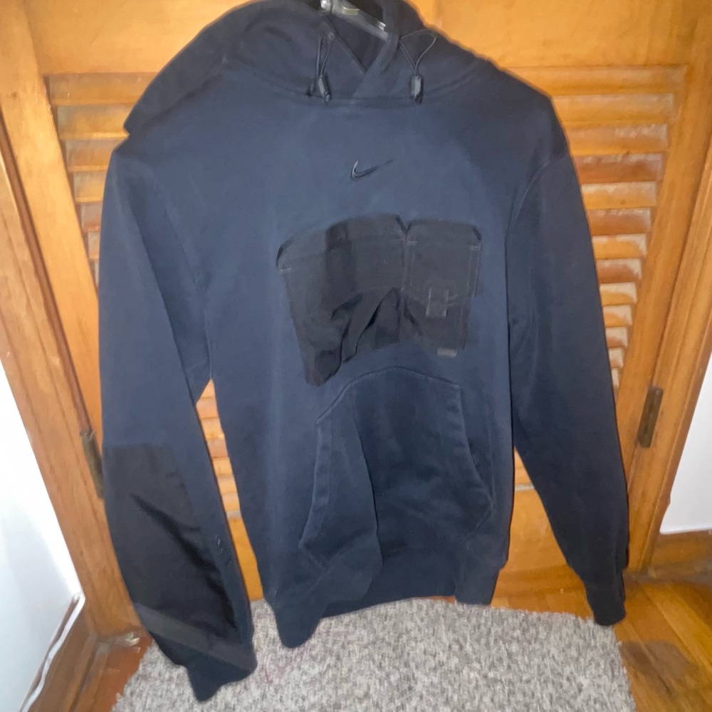 Nocta X Nike Drake Black Hoodie with Unique Pocket Design